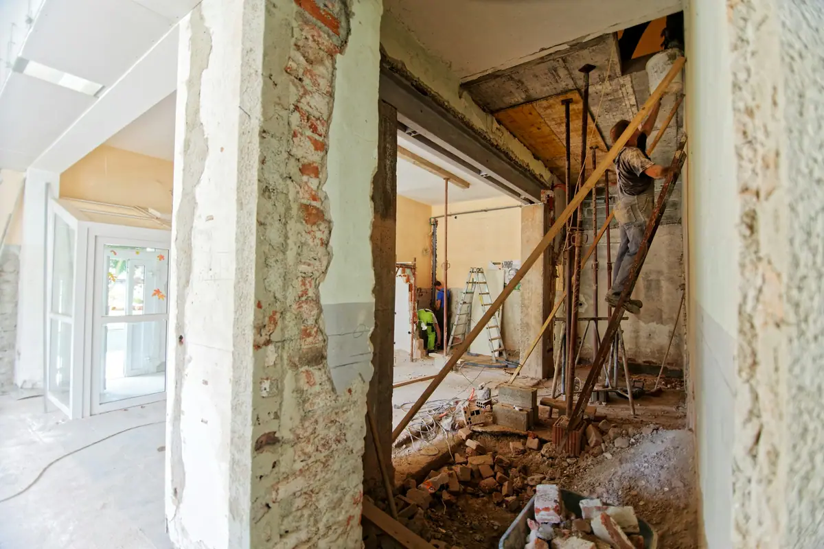 Opened-up wall and scaffolding during demolition