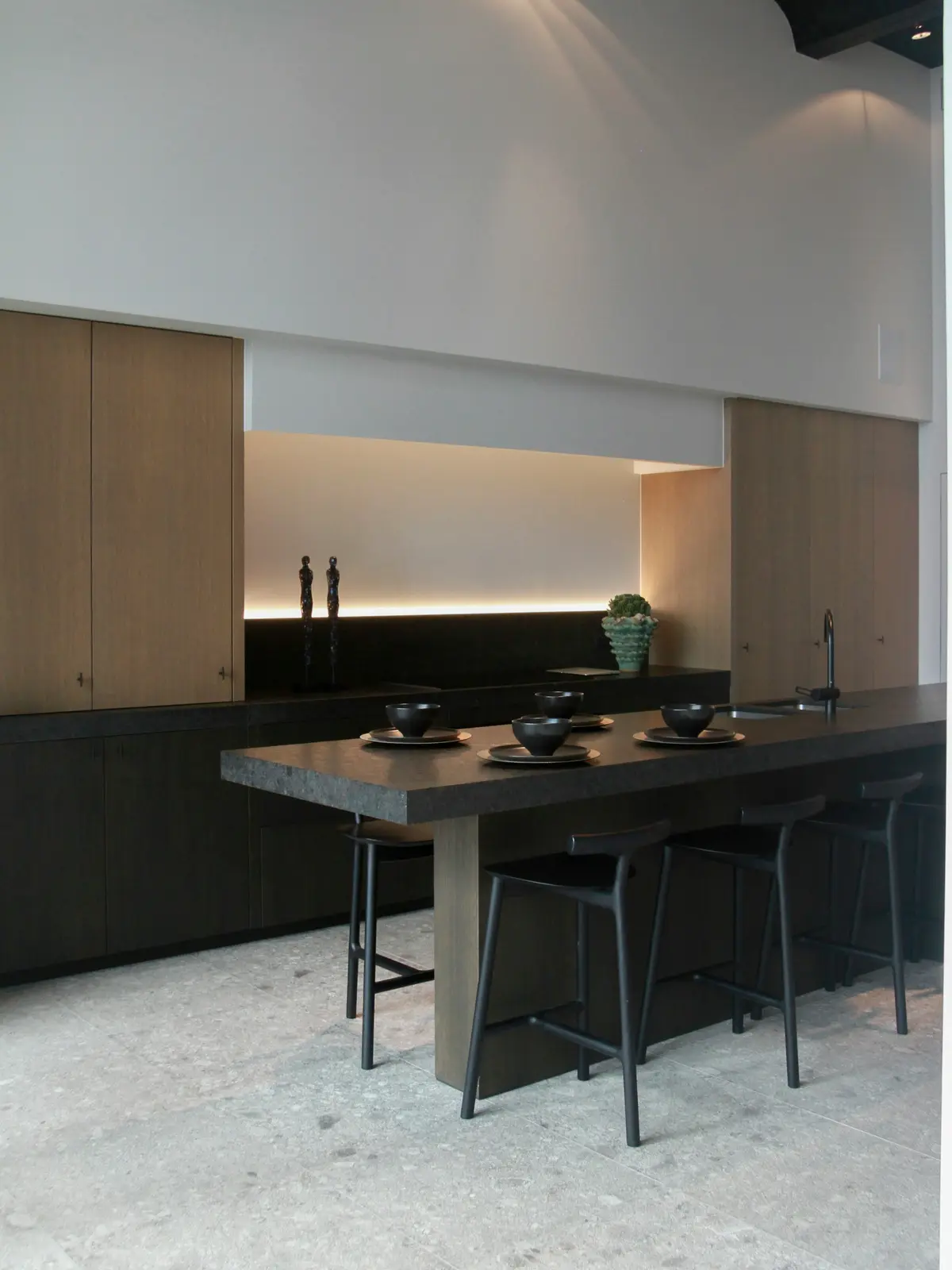 Kitchen island with a dark stone countertop