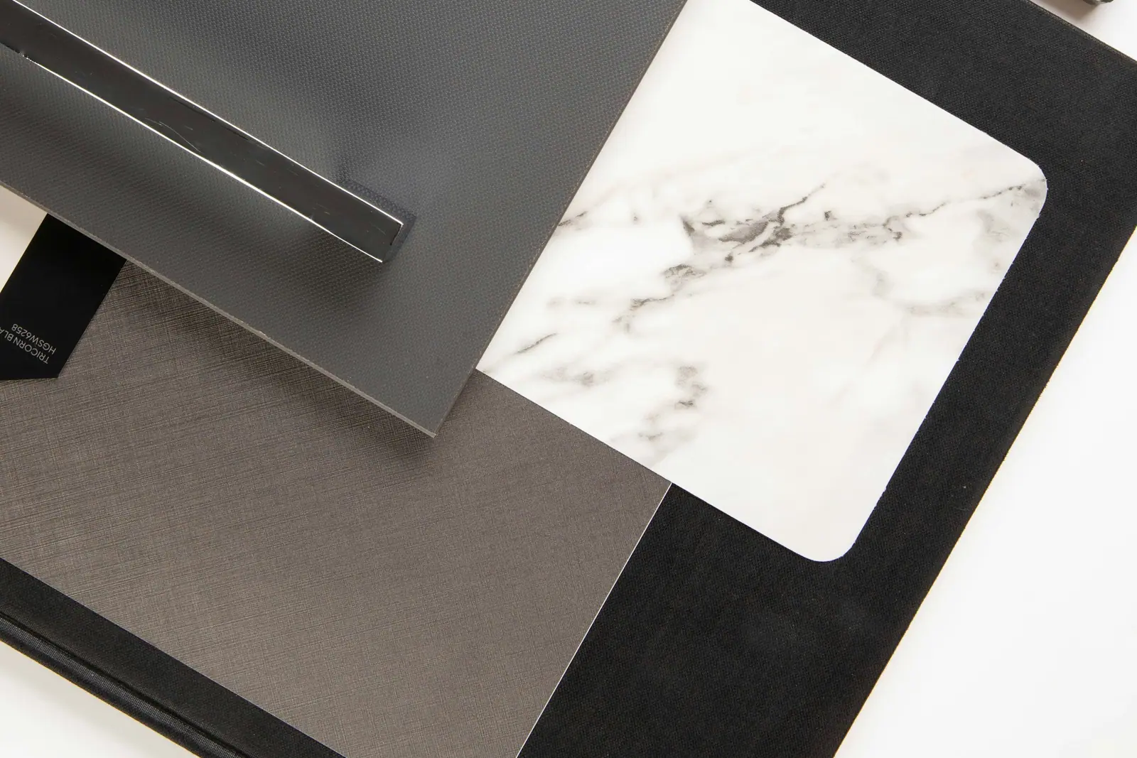 Marble, metal and laminate samples on a table
