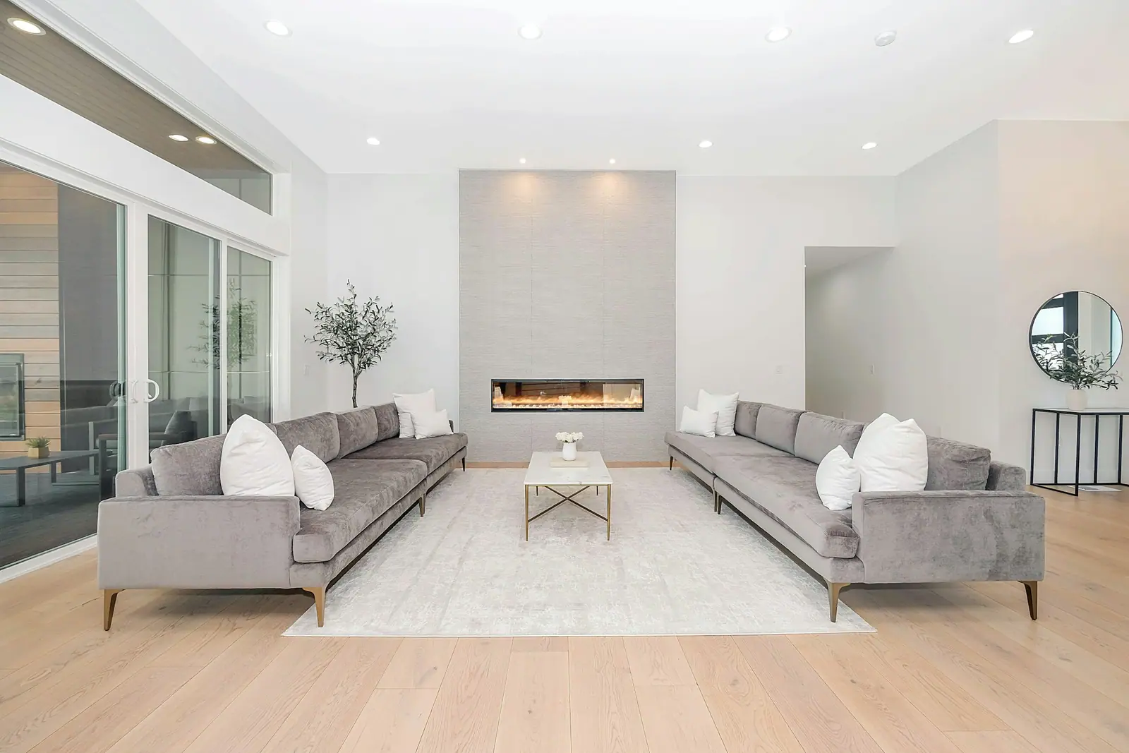 Bright living room with finished hardwood and paint